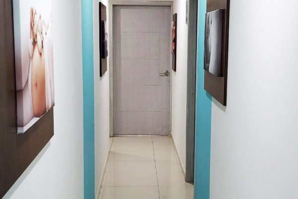 Concibo Reproductive Clinic Fertility Clinic facilities, a hallway where maternity and fertility images are displayed on the walls.